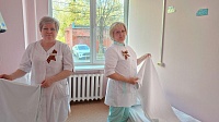 Коломенские врачи выполняют свои обязанности с символом Победы на груди